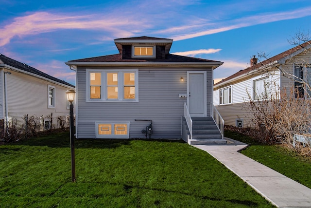 view of front of property with a yard