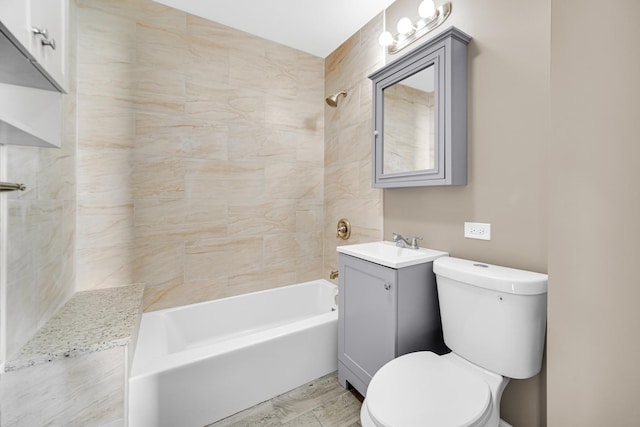 full bathroom with vanity, toilet, and tiled shower / bath combo