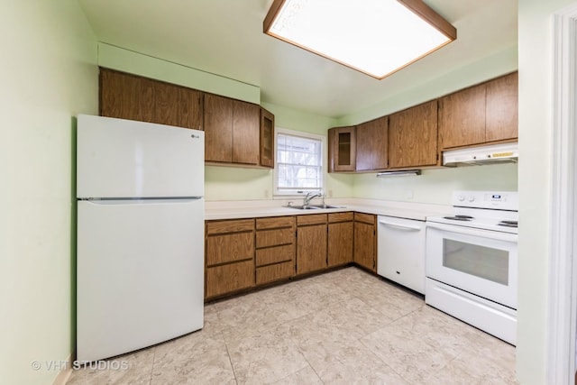 kitchen with sink and white appliances