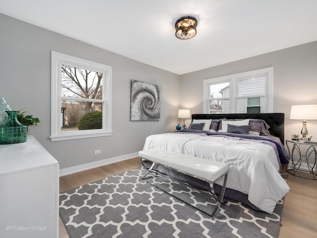 bedroom with hardwood / wood-style flooring