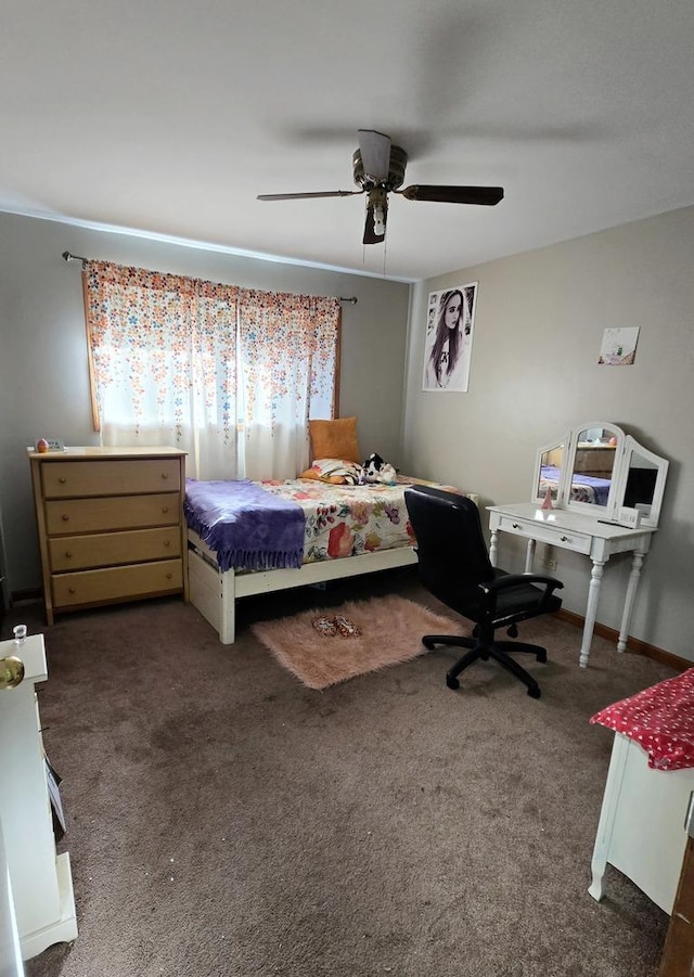 bedroom featuring dark colored carpet and ceiling fan