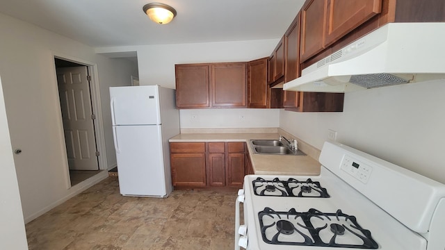 kitchen with sink and white appliances