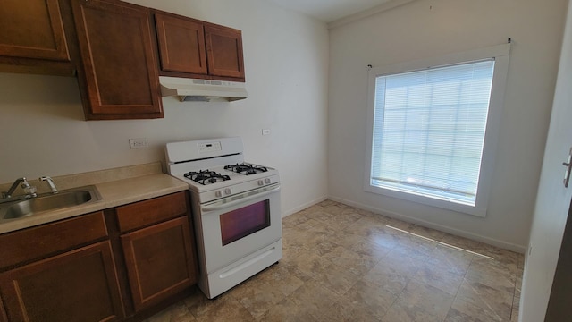 kitchen with sink and white range with gas stovetop