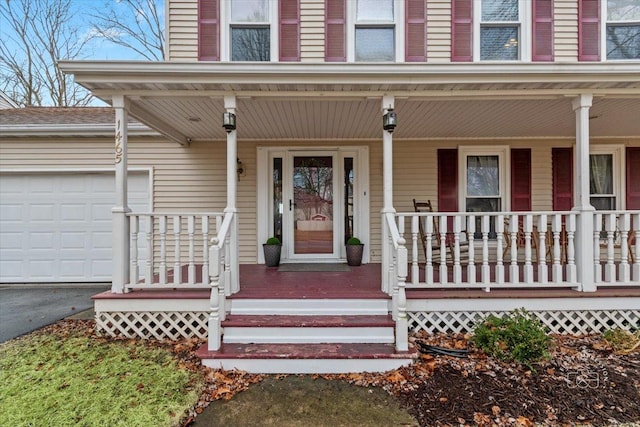 property entrance with a garage and covered porch