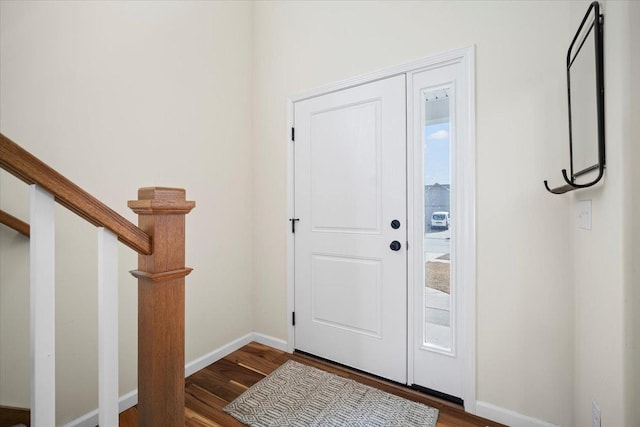 entrance foyer featuring hardwood / wood-style flooring and a healthy amount of sunlight