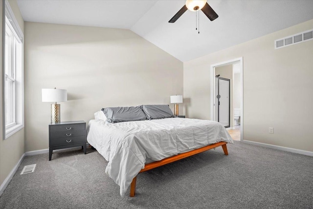 bedroom featuring lofted ceiling, connected bathroom, ceiling fan, and carpet