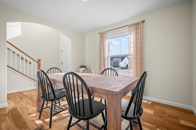 dining space with light hardwood / wood-style flooring