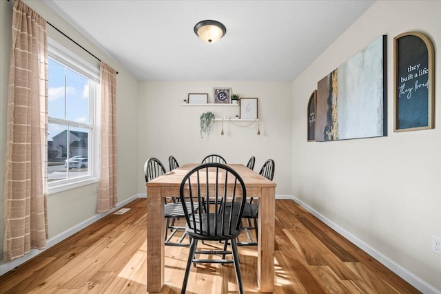 dining space featuring hardwood / wood-style floors