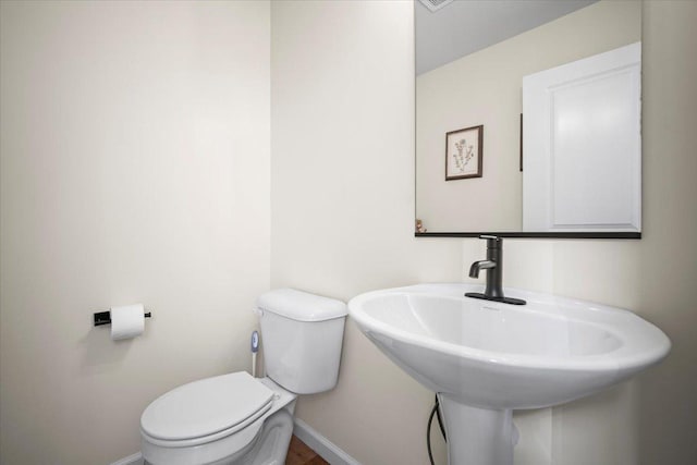 bathroom with sink and toilet