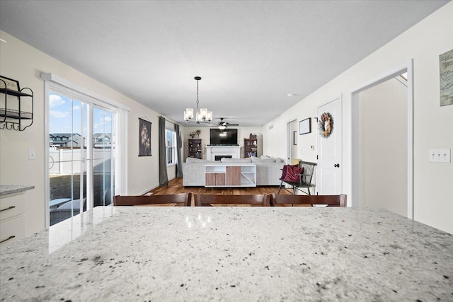 dining area featuring an inviting chandelier and wood-type flooring