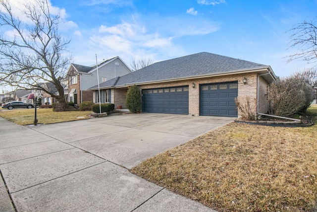 traditional home featuring a garage, brick siding, a shingled roof, concrete driveway, and a front lawn