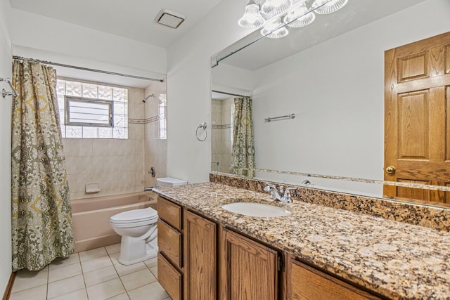 bathroom featuring toilet, vanity, shower / bath combo with shower curtain, and tile patterned floors