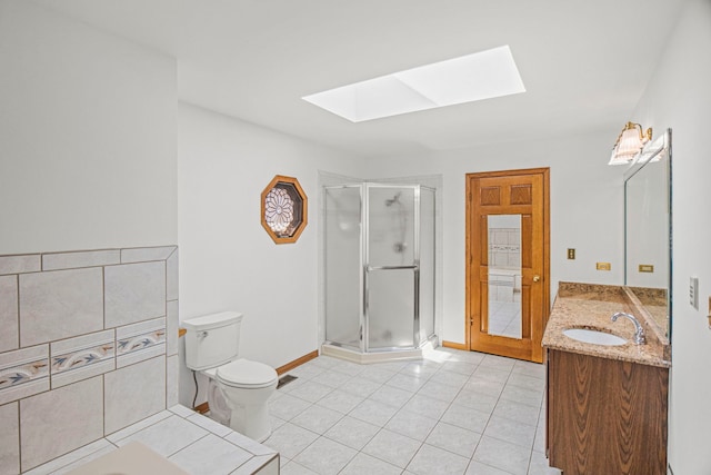 bathroom featuring a skylight, a stall shower, toilet, tile patterned flooring, and a sink