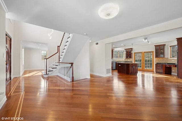 unfurnished living room featuring hardwood / wood-style flooring