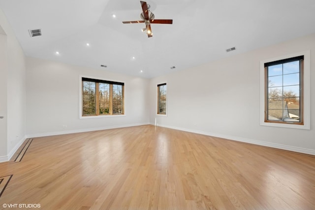 spare room featuring ceiling fan and light hardwood / wood-style floors