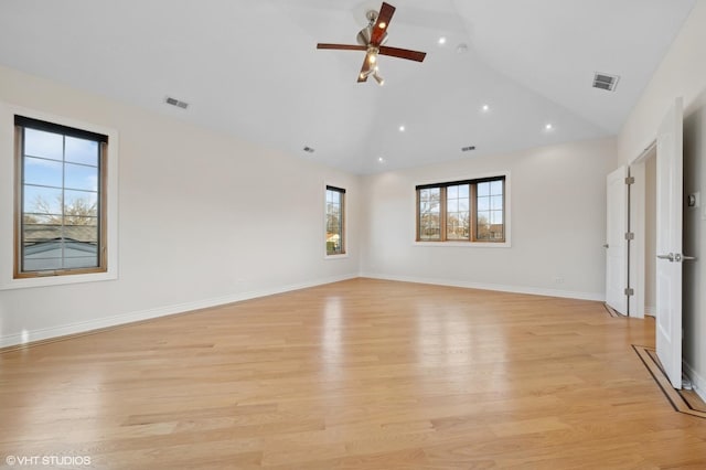 unfurnished room with ceiling fan, high vaulted ceiling, and light hardwood / wood-style floors