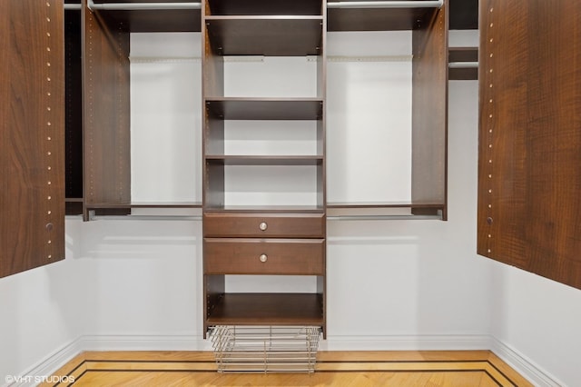 walk in closet featuring hardwood / wood-style floors