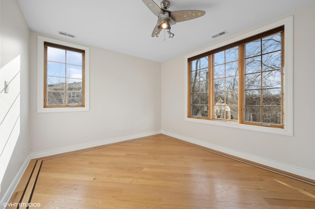 spare room with light hardwood / wood-style flooring and ceiling fan