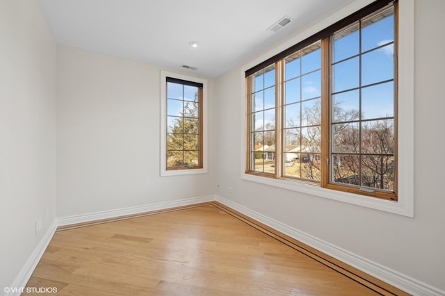 unfurnished room with light hardwood / wood-style flooring