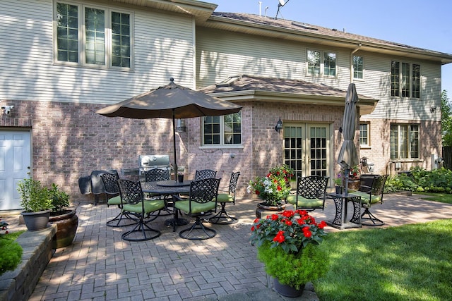 back of property featuring a patio and french doors