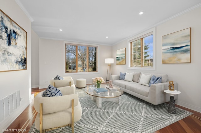 living room with hardwood / wood-style flooring and ornamental molding