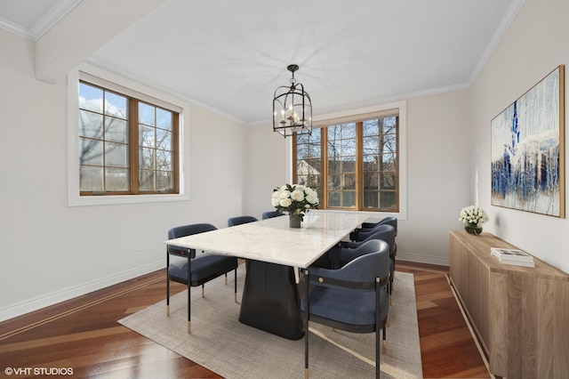 dining area with ornamental molding, dark hardwood / wood-style floors, and a notable chandelier