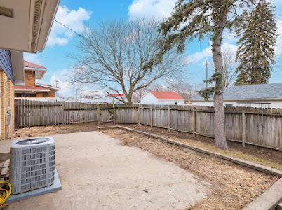 view of yard featuring a patio and central AC