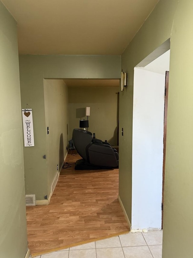 corridor featuring light tile patterned flooring