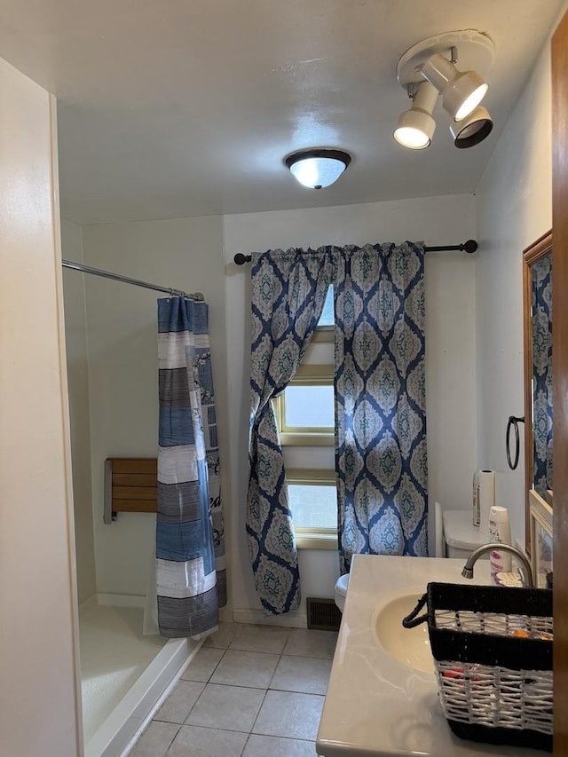 202 Hickory Dr, Roberts, IL 60962 - bathroom with a shower with shower curtain, vanity, toilet, and tile patterned flooring