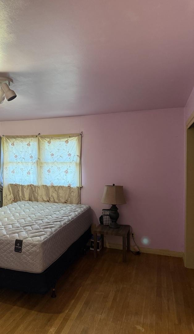 202 Hickory Dr, Roberts, IL 60962 - unfurnished bedroom featuring hardwood / wood-style floors