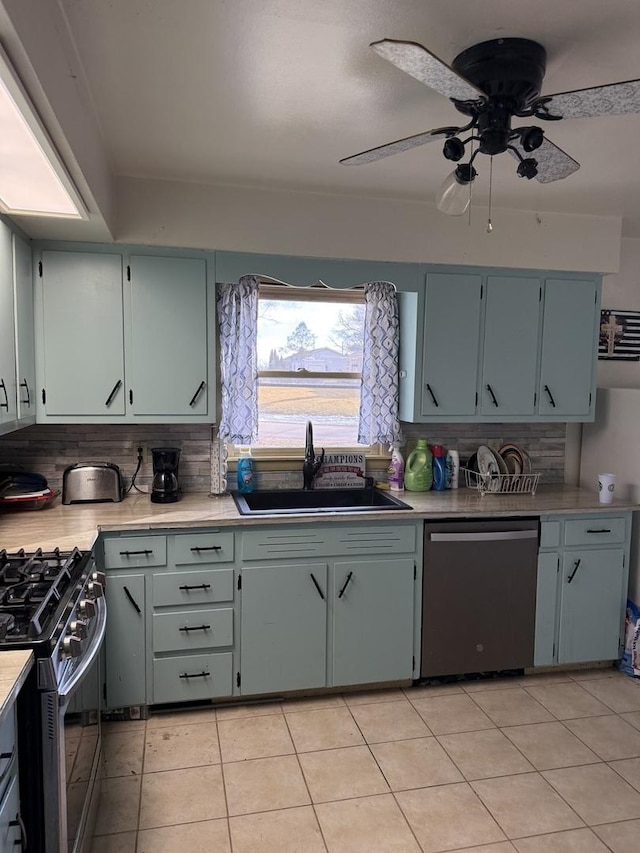 202 Hickory Dr, Roberts, IL 60962 - kitchen with sink, tasteful backsplash, light tile patterned floors, appliances with stainless steel finishes, and ceiling fan