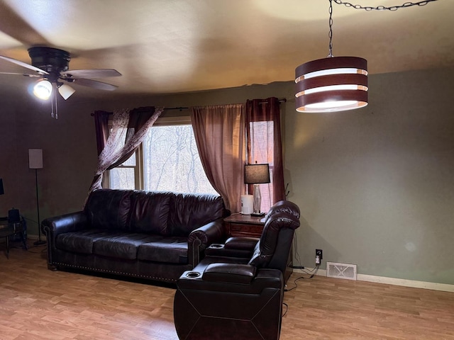 202 Hickory Dr, Roberts, IL 60962 - living room featuring ceiling fan and light hardwood / wood-style floors