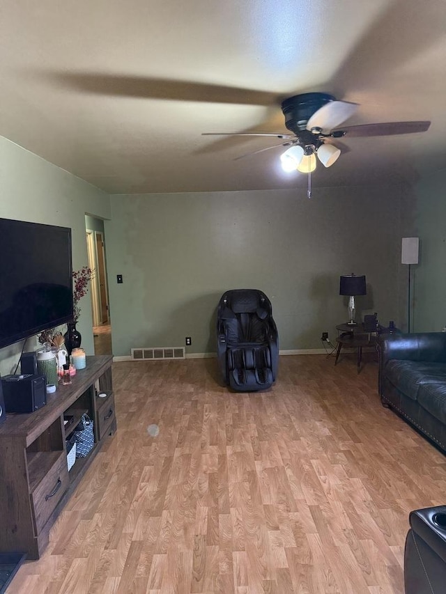 202 Hickory Dr, Roberts, IL 60962 - living room featuring ceiling fan and light hardwood / wood-style floors