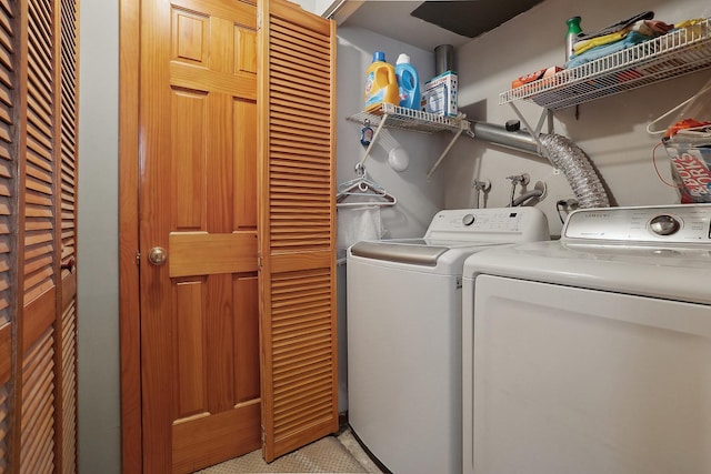 clothes washing area featuring independent washer and dryer