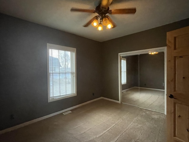 unfurnished bedroom featuring a closet and ceiling fan