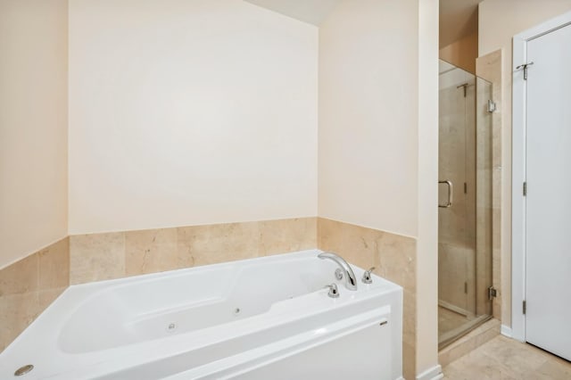 bathroom featuring separate shower and tub