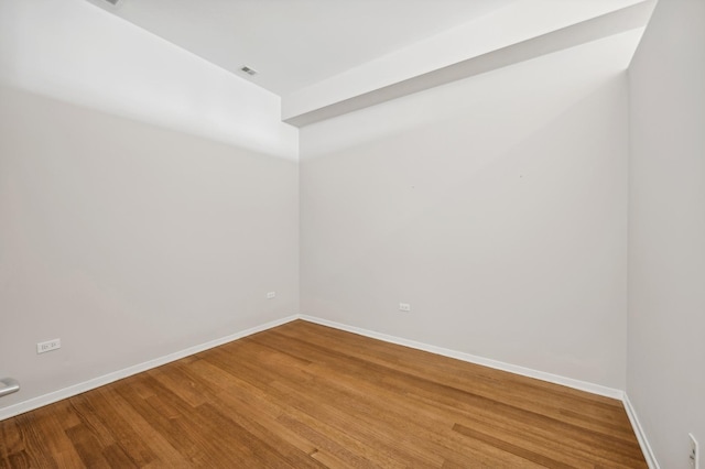 unfurnished room featuring wood-type flooring