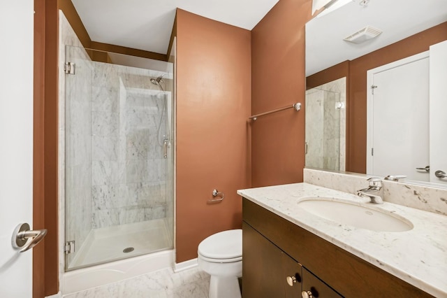 bathroom with vanity, toilet, and walk in shower