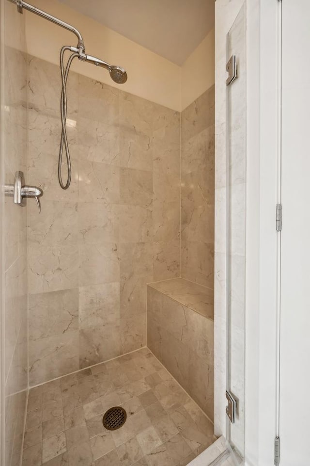 bathroom with tiled shower