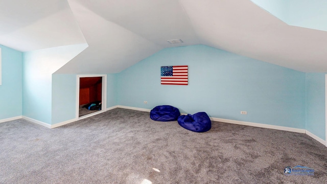 bonus room featuring vaulted ceiling, carpet flooring, visible vents, and baseboards