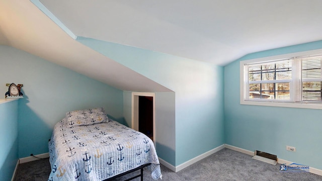 bedroom featuring baseboards, lofted ceiling, and carpet flooring