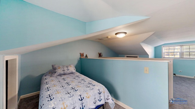 bedroom with baseboards, lofted ceiling, carpet, and visible vents