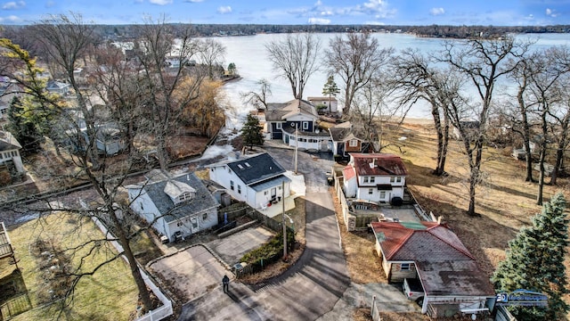 birds eye view of property featuring a residential view and a water view