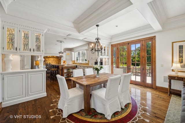 dining area with crown molding, dark wood-type flooring, coffered ceiling, a notable chandelier, and french doors