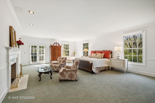 bedroom with ornamental molding, carpet, multiple windows, and access to outside