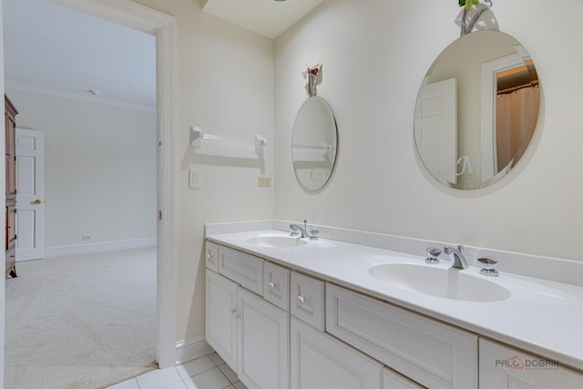 bathroom with ornamental molding, vanity, and tile patterned floors