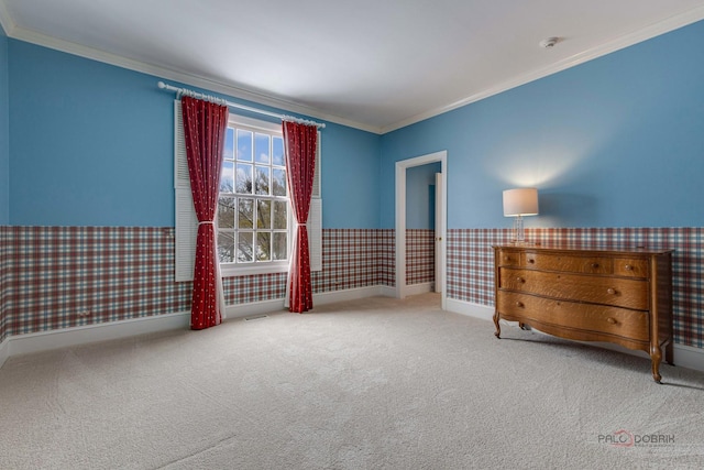 unfurnished room with crown molding and carpet floors