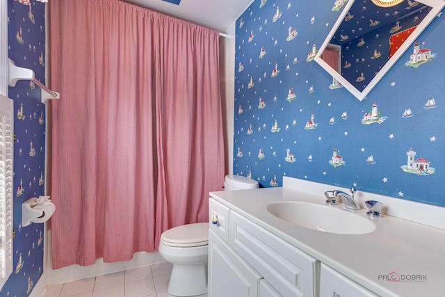 bathroom featuring vanity, toilet, and tile patterned flooring