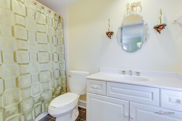 bathroom featuring tile patterned floors, toilet, a shower with shower curtain, and vanity