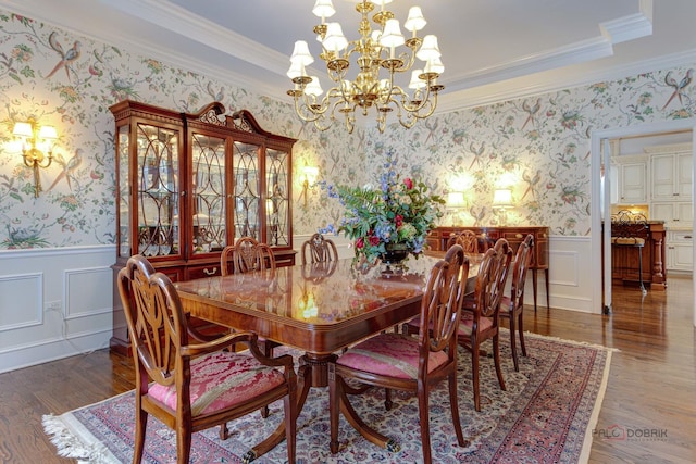 dining room featuring dark wood-type flooring and ornamental molding